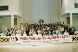 Many people holding a World Methodist Banner