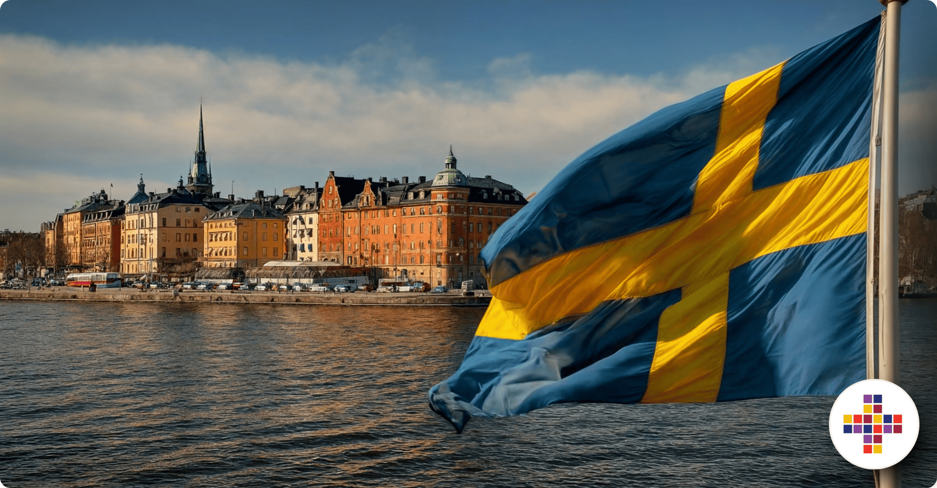 Swedish flag waving with Stockholm city skyline in the background.