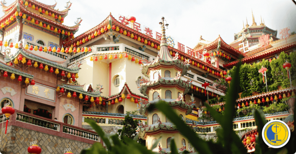 Colorful temple decorated for World Methodist Evangelism celebration with traditional architecture.