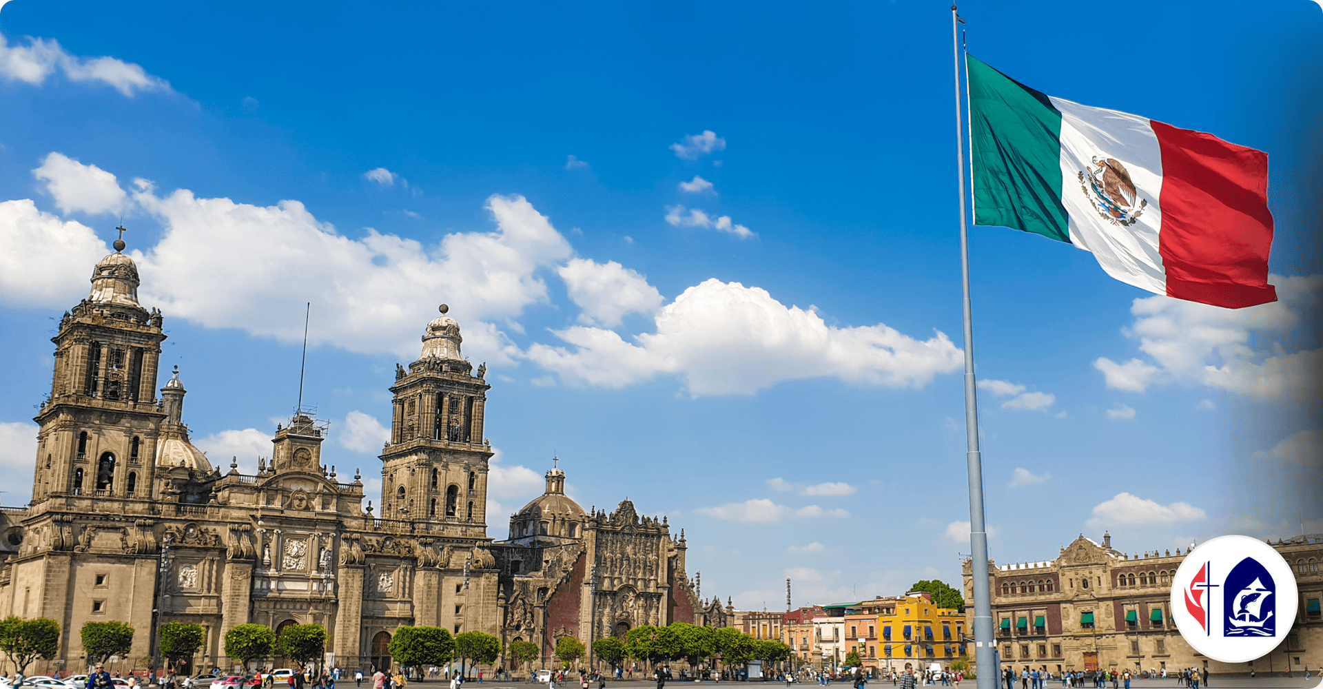 Mexican flag flying over historic cathedral in Mexico City.