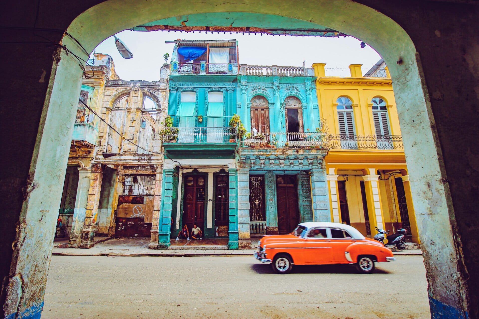 Colorful colonial buildings in Cuba with vintage car.